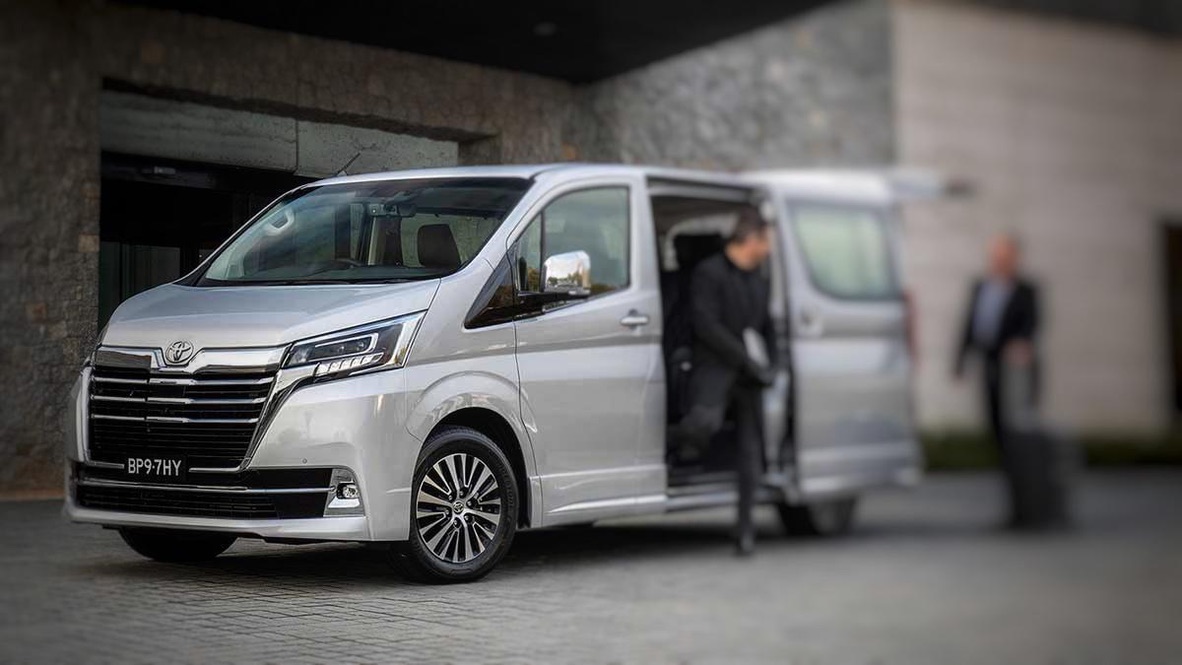 Mercedes-Benz Sprinter cabin access, door open on a residential street